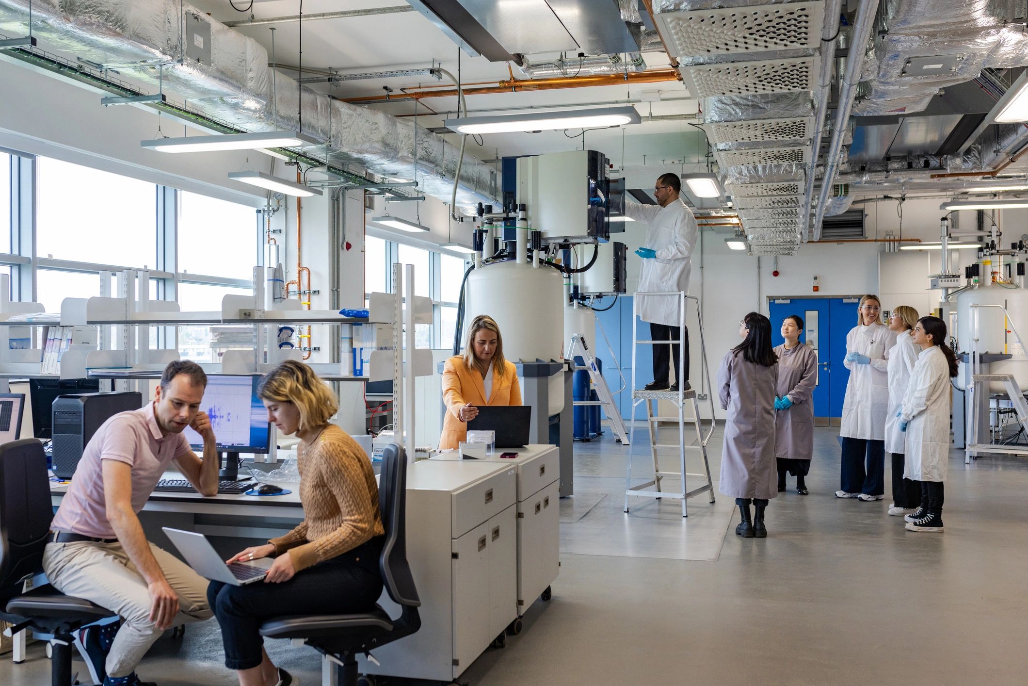 Scientific team reviewing research in a professional lab